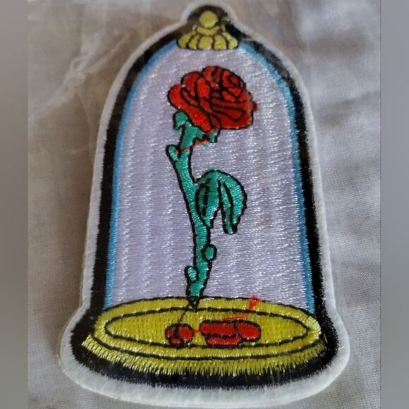 DISNEY IRON ON PATCH  BEAUTY AND THE BEAST GLASS DOMED ROSE 3"1/2" - Picture 1 of 3